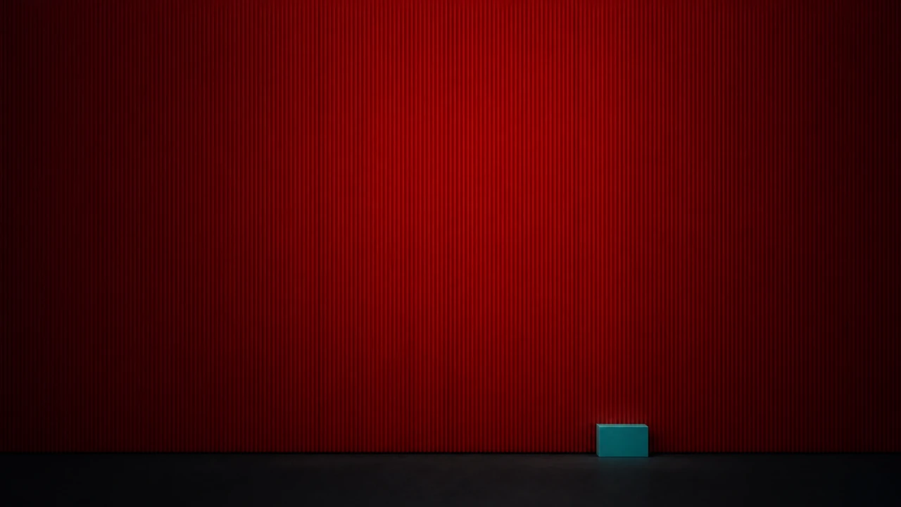 A small crisp teal block set against a vast red striated volume that runs past the frame, a size comparison between a short secured window and a far longer unwatched one